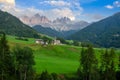 The Odle mountain peaks and the church of Santa Maddalena, Val di Funes valley. Picturesque. Alpe di Siusi or Seiser Alm with