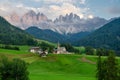 The Odle mountain peaks and the church of Santa Maddalena, Val di Funes valley. Picturesque. Alpe di Siusi or Seiser Alm with