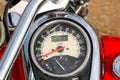 Odometer Gauge of a Custom Red Cruiser Motorcycle