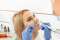Odontologist making bleaching process in mouth of patient Royalty Free Stock Photo