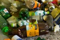 Empty beer and soda plastic bottles on abandoned house floor close up shot.