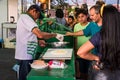 Man making tapioca pancakes and clients looking and waiting at Expoeiras