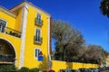 Beautiful yellow building with garden in Lisbon