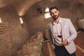 Oenologist tasting wines in cellar