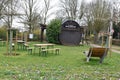 Oestrich-Winkel, Germany - 03 14 2022: Huge wine barrel as a wine tasting area, backside with flowers