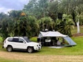 Off road Australian caravan and vehicle parking in outdoor campsite