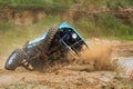 Off-road car crossing mud obstacle Royalty Free Stock Photo