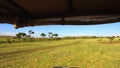 Off-road car driving across savanna at africa