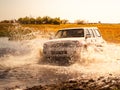 Off-road car fording water on safari wild drive in Chobe National Park, Botswana, Africa Royalty Free Stock Photo