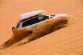 Off-road car going up the dune Royalty Free Stock Photo