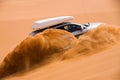 Off-road car going up the sand dune Royalty Free Stock Photo