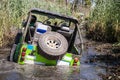 Off road car overcoming a swampy area Royalty Free Stock Photo