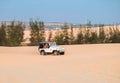 Off road car vehicle in white sand dune desert at Mui Ne Royalty Free Stock Photo