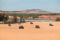 Off road car vehicle in white sand dune desert at Mui Ne Royalty Free Stock Photo