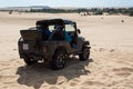Off road car vehicle in white sand dune desert at Mui Ne Royalty Free Stock Photo