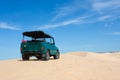 Off road car vehicle in white sand dune desert at Mui Ne Royalty Free Stock Photo