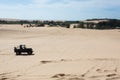 Off road car vehicle in white sand dune desert Royalty Free Stock Photo