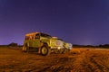 Off-road cars under starlight sky night desert landscape at Hegra, Al Ula, Saudi Arabia Royalty Free Stock Photo