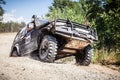 Off road racing car driving along the dusty road Royalty Free Stock Photo