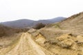 Off-road road that leads to Rachis village and mountain landscape Royalty Free Stock Photo