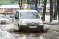 Off-road in Russia. The car rides on a deep puddle in the spring