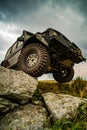 Off-road travel on mountain road. Car tire. Tire for offroad. Offroad vehicle stuck on impenetrable road after rain in Royalty Free Stock Photo