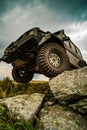 Off-road travel on mountain road. Car tire. Tire for offroad. Offroad vehicle stuck on impenetrable road after rain in Royalty Free Stock Photo