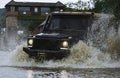 Off-road travel on mountain road. Jeep outdoors adventures. Drag racing car burns rubber. Extreme. Off-road car. Jeep Royalty Free Stock Photo