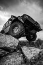 Off-road travel on mountain road. Car tire. Tire for offroad. Offroad vehicle stuck on impenetrable road after rain in Royalty Free Stock Photo