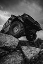 Off-road travel on mountain road. Car tire. Tire for offroad. Offroad vehicle stuck on impenetrable road after rain in Royalty Free Stock Photo