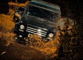 Off the road travel on mountain road. Track on mud. 4x4 Off-road suv car. Safari. Expedition offroader. Offroad vehicle