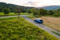 Off road traveling in blue Skoda Scala car at country side road