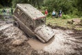 Off-road Trophy UAZ 469 stucks in mud pit.