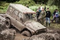 Off-road Trophy UAZ 469 stucks in mud pit.