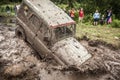 Off-road Trophy UAZ 469 stucks in mud pit.