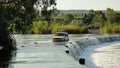 Off-road truck driving the Ivanhoe Crossing, Kununurra, Western Australia, Australia. A concrete causeway over Ord River Royalty Free Stock Photo