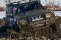 Off-road vehicle brand Nissan overcomes the track Royalty Free Stock Photo