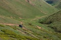 Off-road vehicle on dangerous off-road mountain trail background. Offroad journey, travel. Summer travel concept. Mountain road Royalty Free Stock Photo