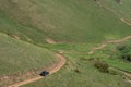 Off-road vehicle on dangerous off-road mountain trail background. Offroad journey, travel. Summer travel concept. Mountain road Royalty Free Stock Photo