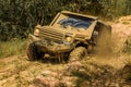 Off-road vehicle goes on the mountain. Tires in preparation for race. Mud and water splash in off the road racing Royalty Free Stock Photo