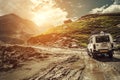 Off-road vehicle goes on the mountain way during the rainy seaso Royalty Free Stock Photo