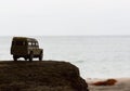 Off-road vehicle goes on the mountain way during the rainy season Royalty Free Stock Photo