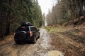 Off-road vehicle goes on the mountain way during the rainy season Royalty Free Stock Photo