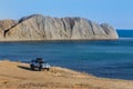 off-road vehicle on the high coast of the sea Royalty Free Stock Photo