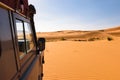 Off- road vehicle oldtimer in Sahara dunes, Morocco