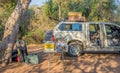 An off-road vehicle parked at a camping spot in the African wilderness