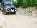 Off-road vehicle slides down a sandy slope, 4x4 Royalty Free Stock Photo