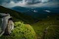 Off-road vehicle stuck on impenetrable road after rain in the countryside. SUV race on dirt. Off road car on mountain Royalty Free Stock Photo