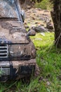 Off-road vehicle stuck in the mud. Dirty offroad car in swamp. Adventure travel concept. 4x4 SUV got bogged. Journey, tourism Royalty Free Stock Photo