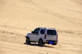 Off-road vehicle traveling in the desert Royalty Free Stock Photo